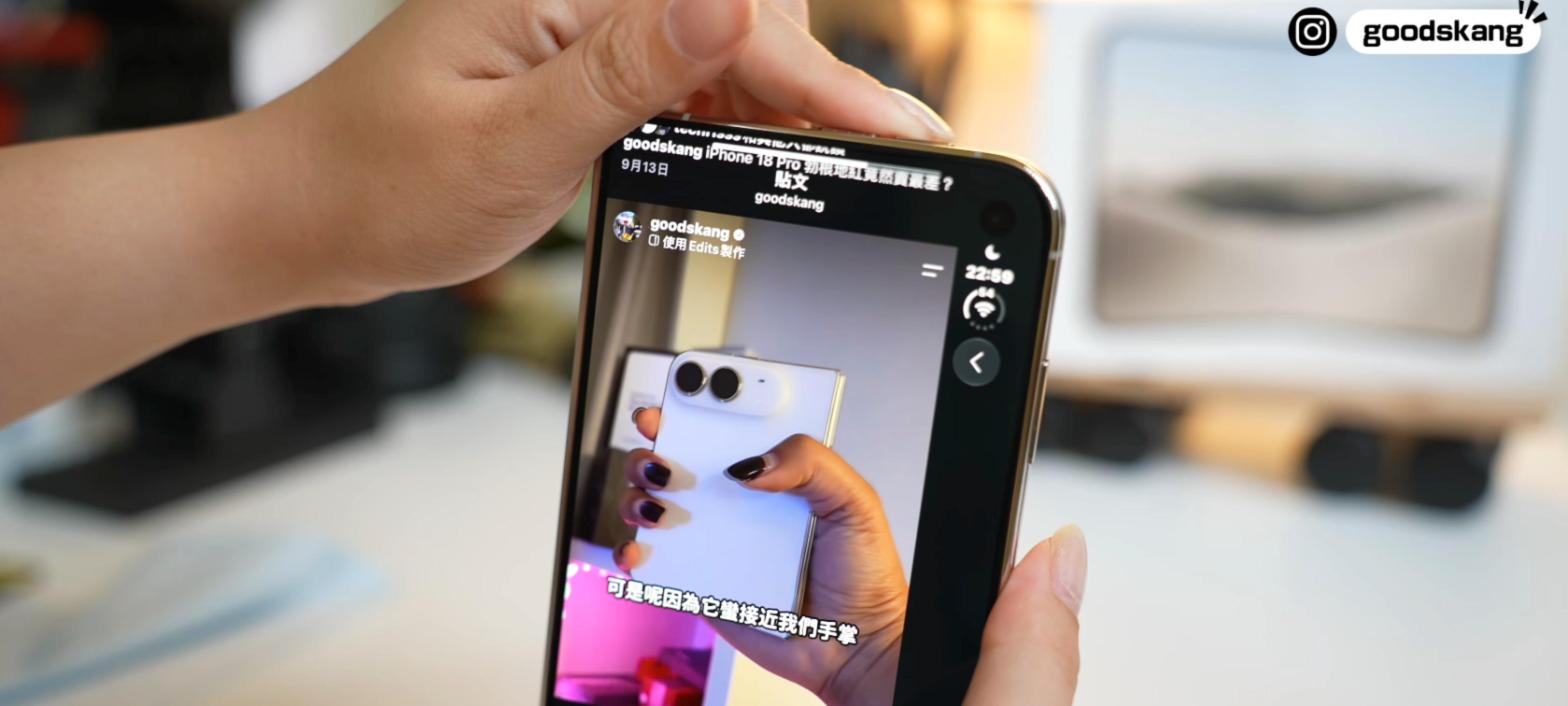 手指往上伸去按 iPhone Duo 機身上端的音量鍵